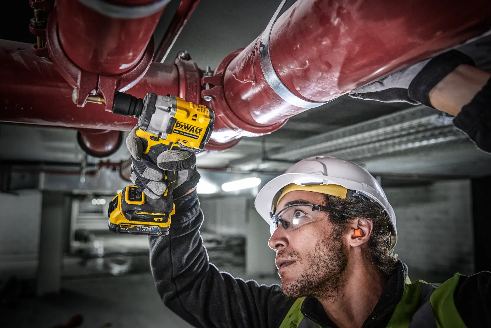 DEWALT 18V XR brushless impact wrench with POWERSTACK battery, shown upright on white background.
